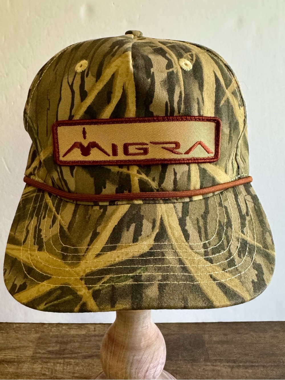 MIGRA PREMIUM MOSSY OAK SHADOW GRASS AND TAN CAMO TRUCKER HAT
